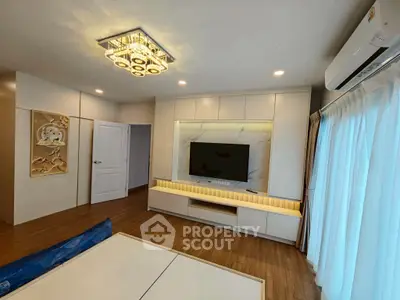 Modern living room with stylish lighting and sleek TV unit