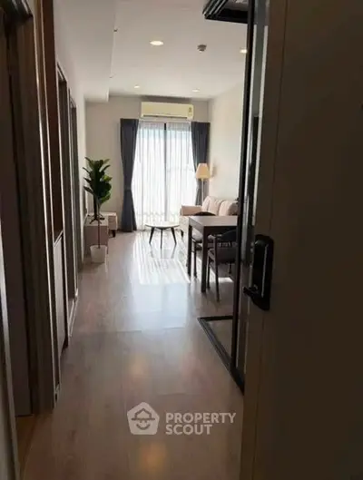 Modern living room with wooden flooring and natural light