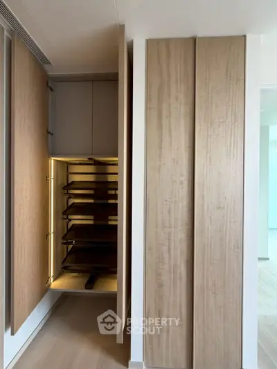Modern interior with sleek wooden storage unit and open shelving, perfect for stylish organization.