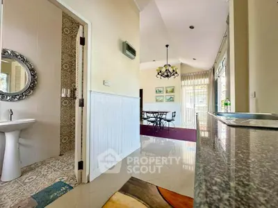 Spacious open-plan living area with elegant dining space and stylish decor