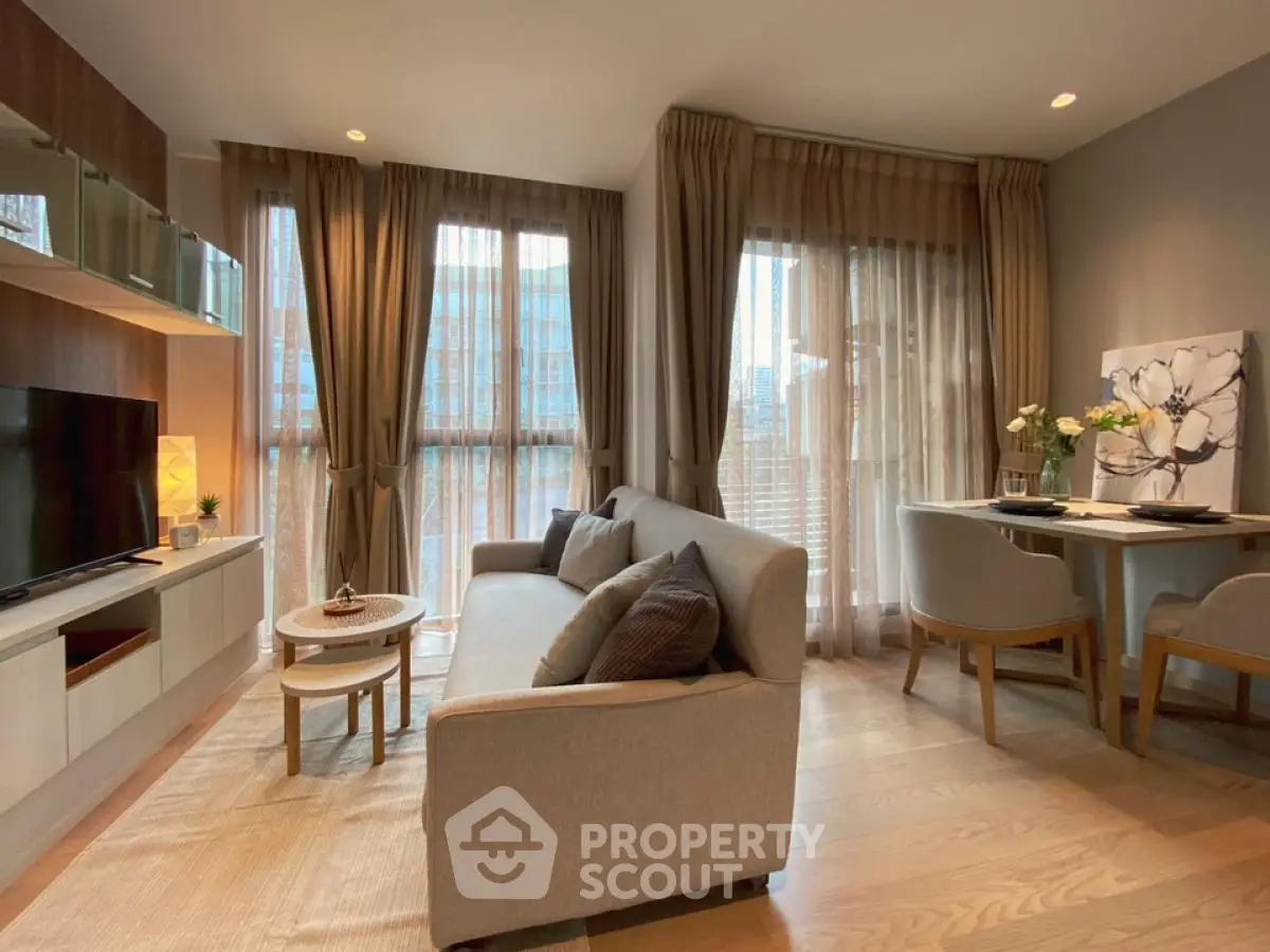 Modern living room with elegant decor and large windows in a stylish apartment