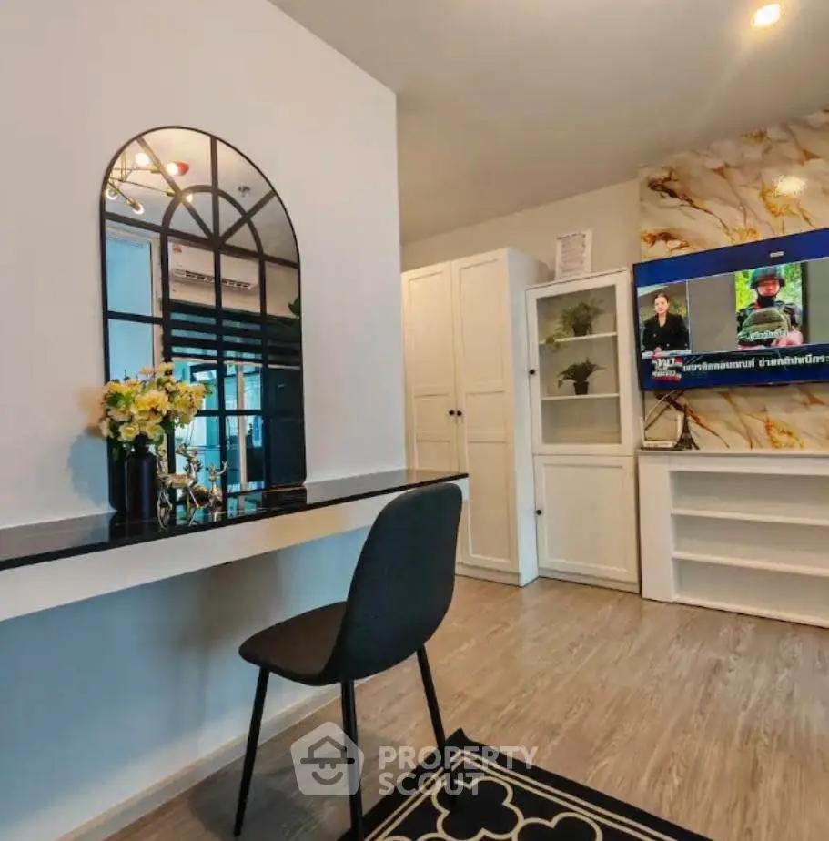 Stylish modern living room with elegant decor and wall-mounted TV