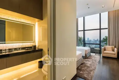 Luxurious bedroom with city view and modern bathroom in high-rise apartment