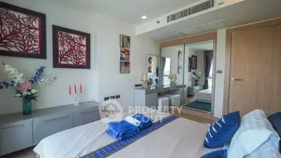 Luxurious bedroom with elegant decor and mirrored wardrobe