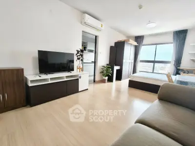 Spacious modern studio apartment with open layout and large window view.