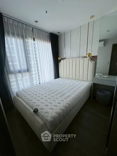Luxurious bedroom with elegant bed and natural light in modern apartment