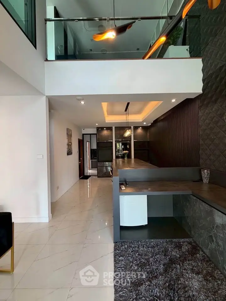 Modern duplex interior with sleek design and open layout, featuring stylish lighting and contemporary finishes.