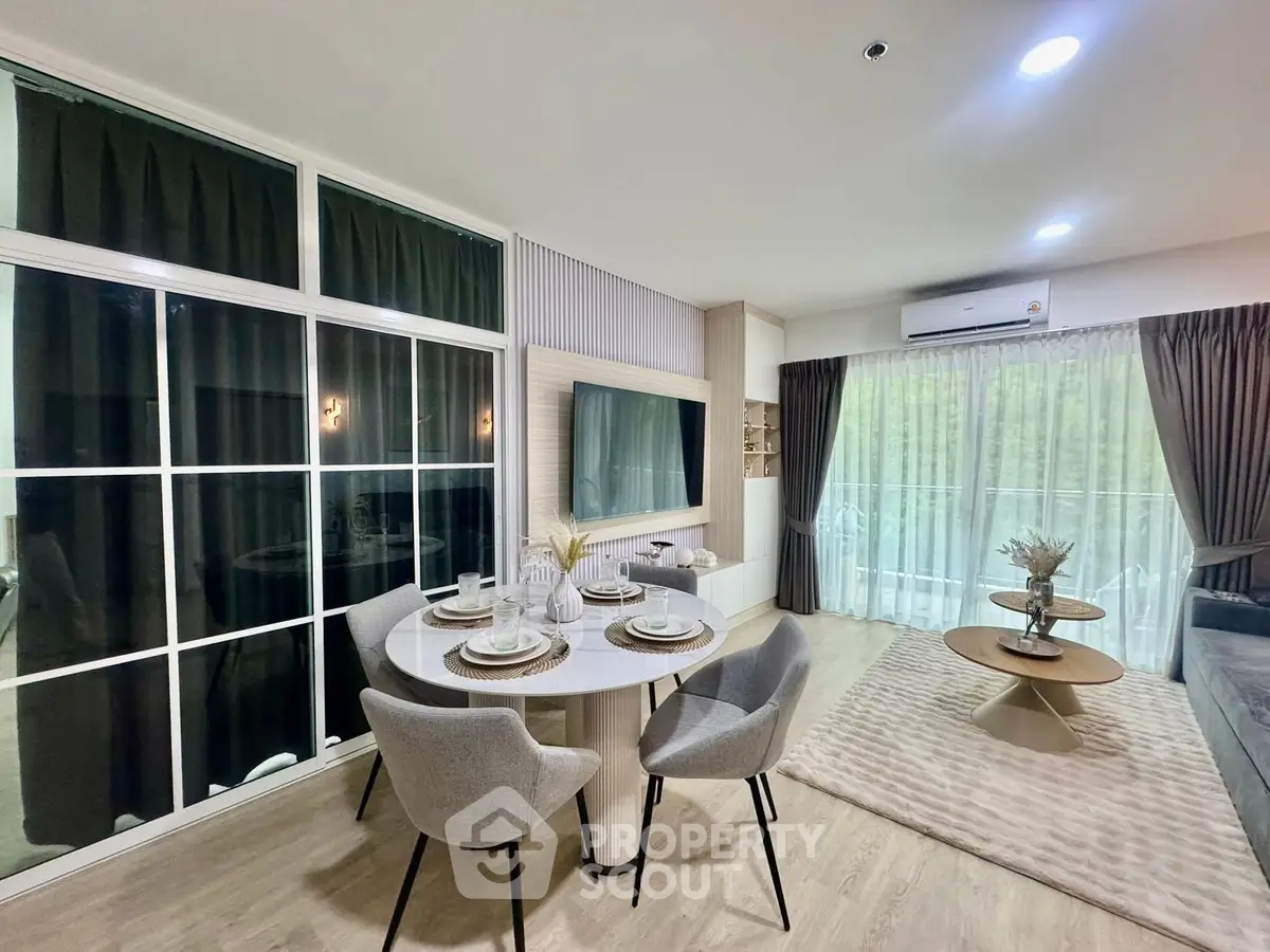 Modern living room with elegant dining area and large windows