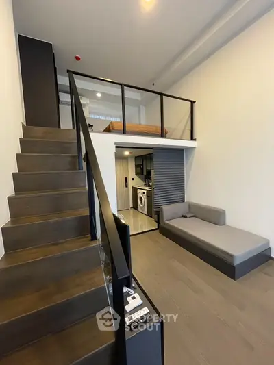 Modern loft apartment with mezzanine bedroom and sleek interior design