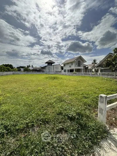 Spacious green plot with potential for development in serene neighborhood