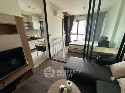 Modern studio apartment with open layout, featuring a cozy living area, compact kitchen, and bright bedroom.