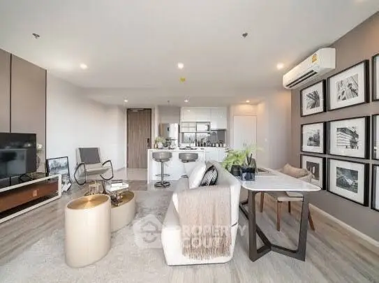 Modern living room with open kitchen and stylish decor