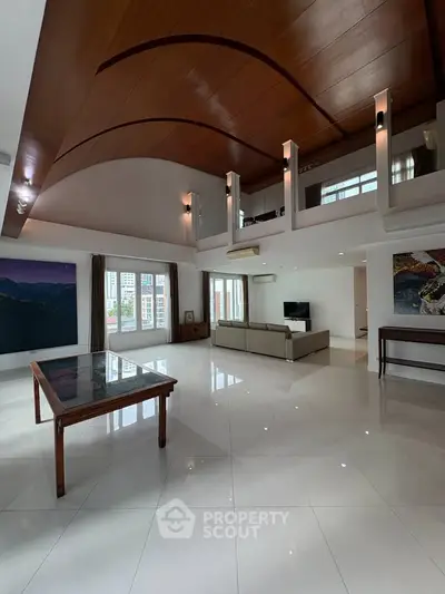 Spacious modern living room with high ceilings and elegant decor