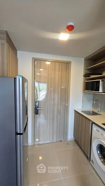 Modern kitchen with sleek appliances and closed layout design