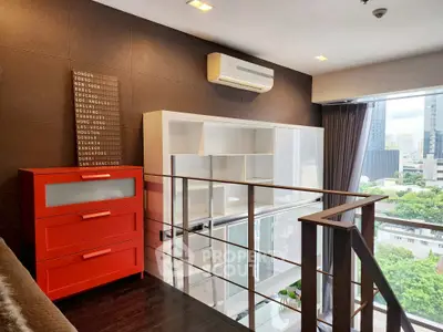 Modern loft with stylish red dresser and city view