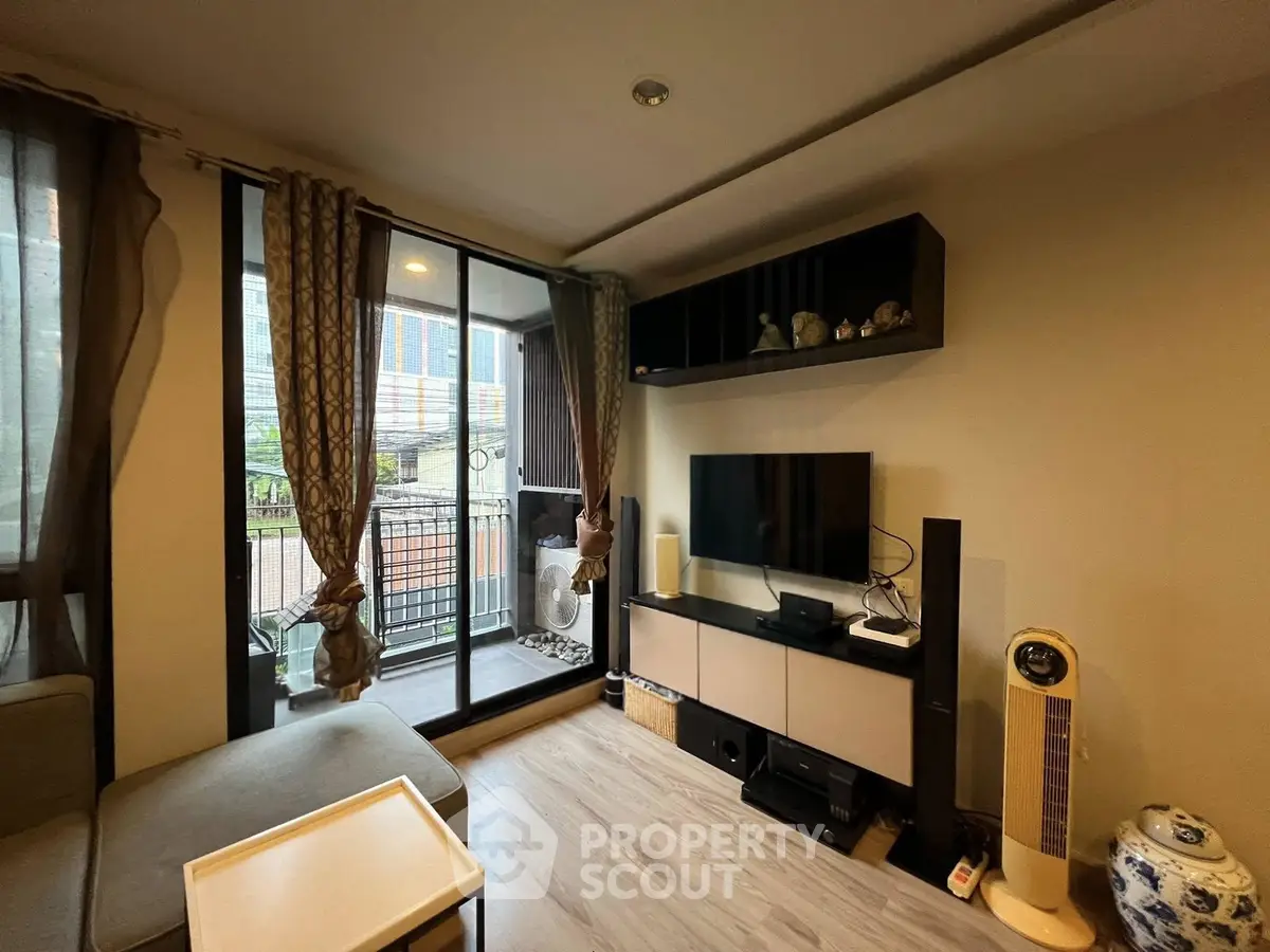 Modern living room with balcony access and stylish decor