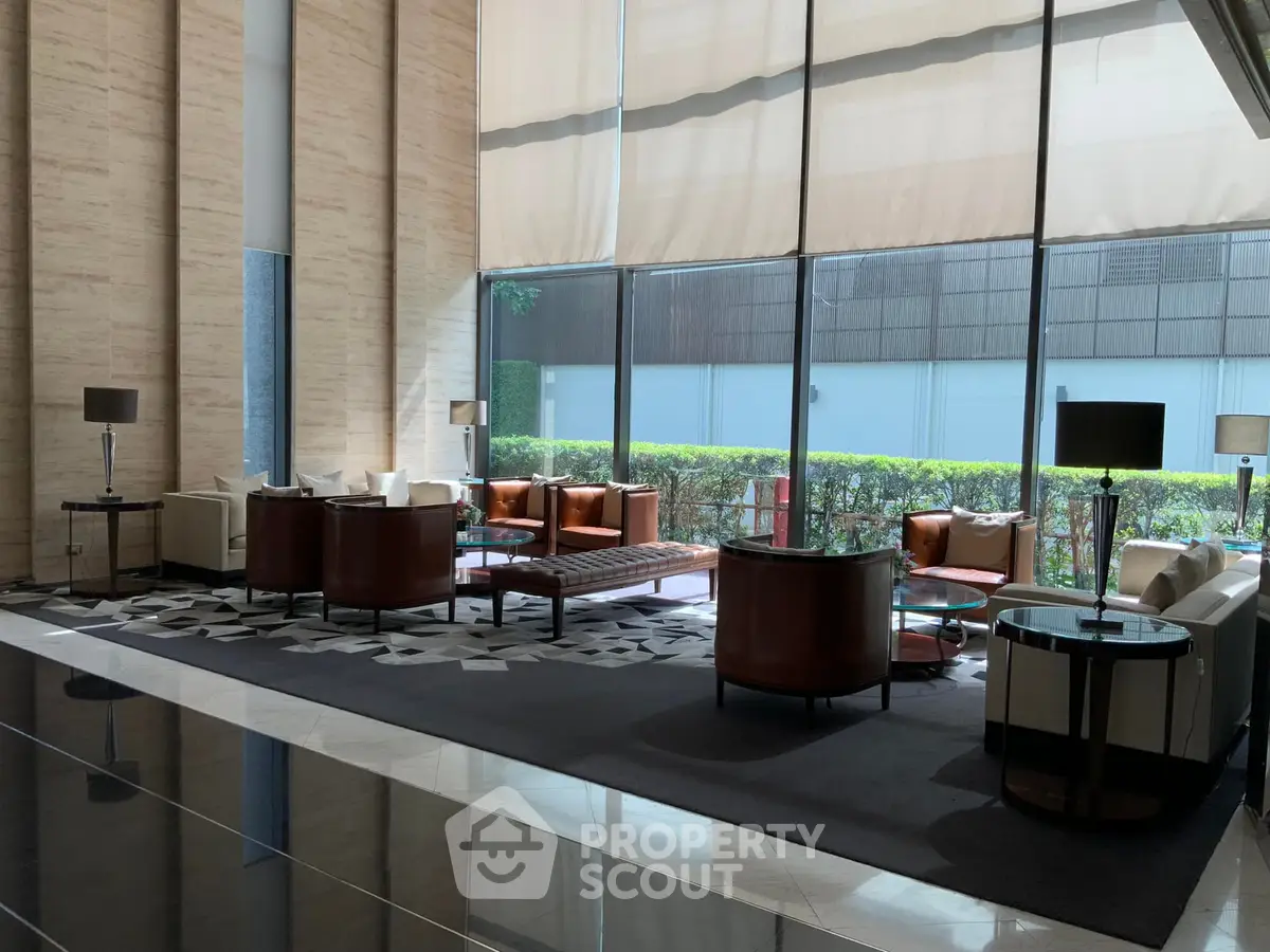 Luxurious modern lobby with elegant seating and floor-to-ceiling windows