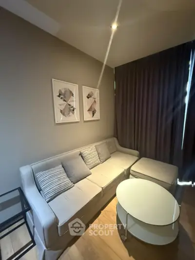 Cozy living room with modern sofa and stylish decor, perfect for relaxation.