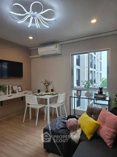 Modern living room with stylish lighting and cozy decor in a contemporary apartment.