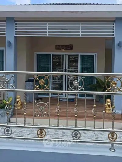 Charming single-story home with decorative metal gate and inviting entrance.