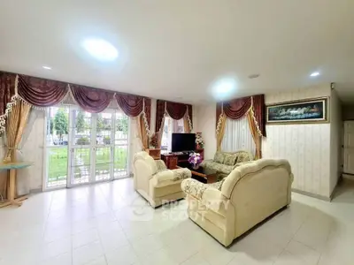 Spacious living room with elegant decor and garden view