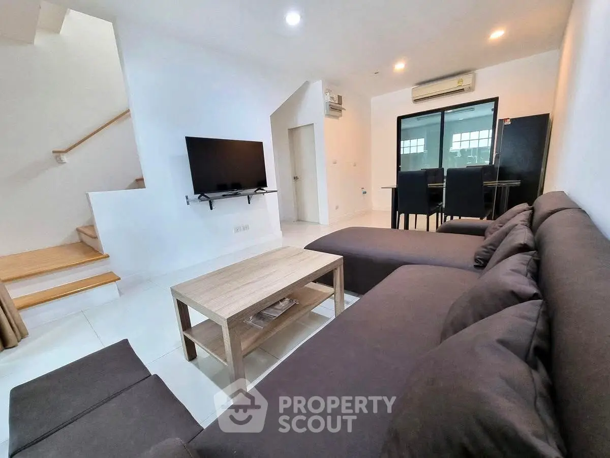 Spacious modern living room with sleek furniture and open layout