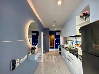 Modern kitchen with sleek cabinets and stylish lighting