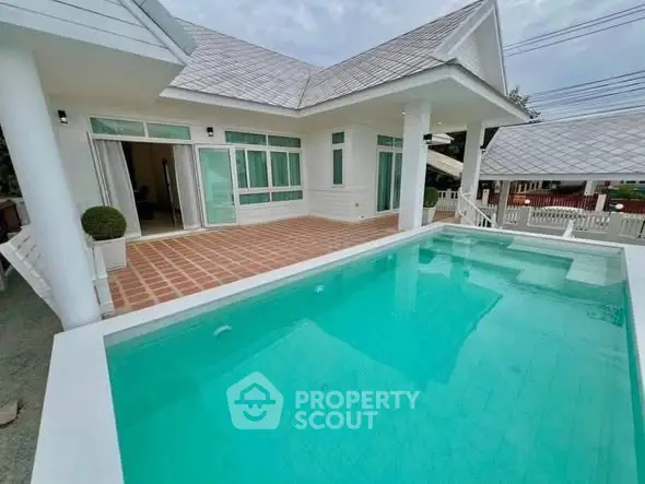 Stunning modern home with private pool and spacious patio area.