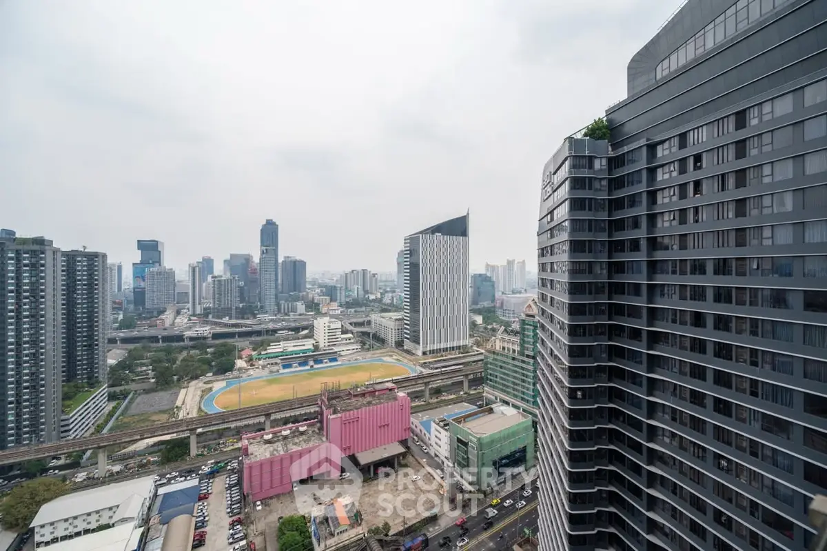 Stunning cityscape view from high-rise building with modern architecture and vibrant urban landscape.