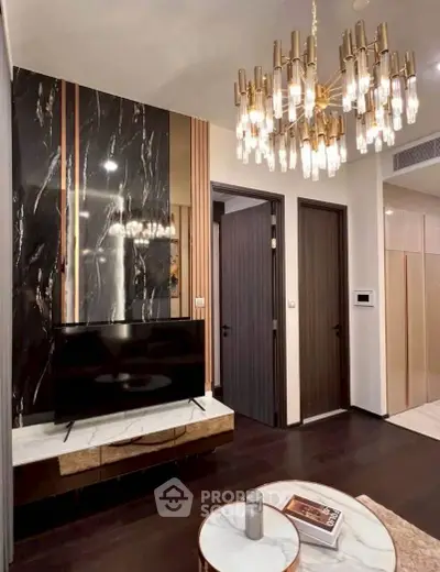 Luxurious living room with elegant chandelier and modern decor