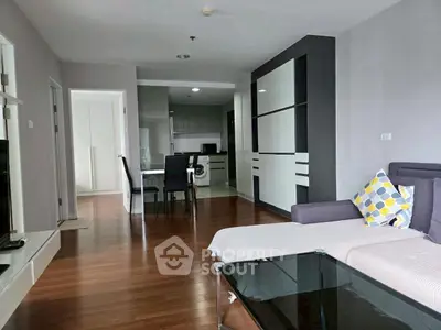 Modern living room with open kitchen and stylish decor