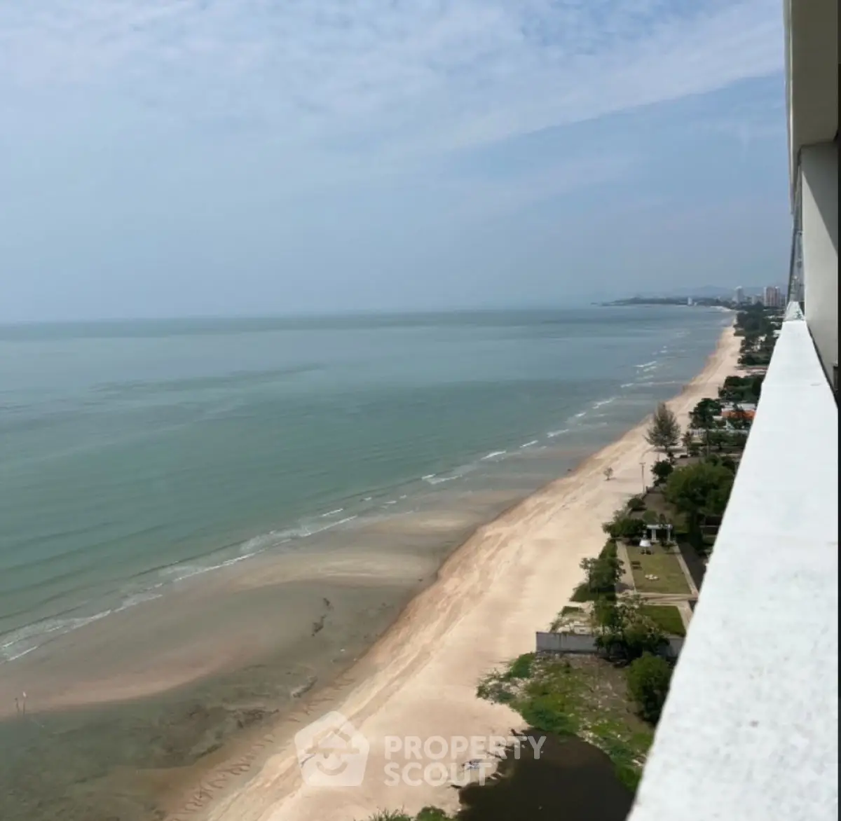 Stunning beachfront view from high-rise balcony, perfect for seaside living.