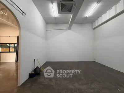 Spacious empty room with high ceiling and industrial design