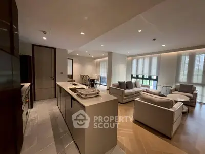 Spacious modern living room with open kitchen and elegant furnishings