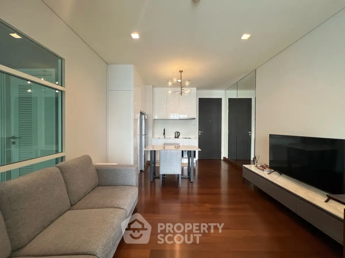 Modern open-plan living room with sleek kitchen and stylish decor