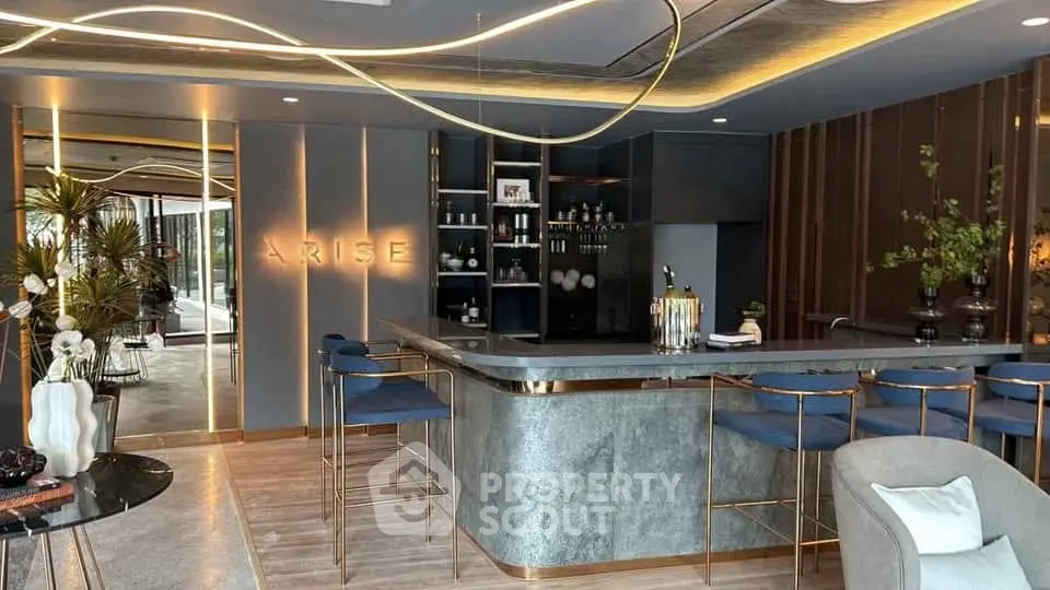 Luxurious modern living room with stylish bar and elegant lighting, perfect for entertaining guests.