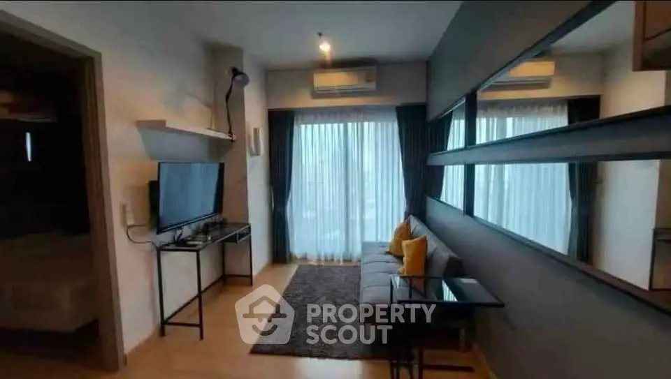 Modern living room with stylish decor and large windows for natural light