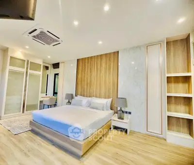 Luxurious modern bedroom with elegant wood paneling and ambient lighting