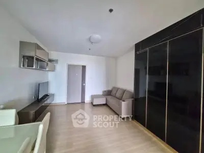 Modern living room with sleek furniture and ample natural light