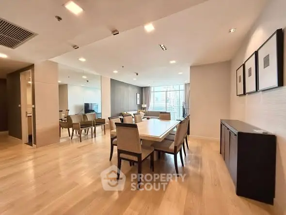 Spacious modern dining and living area with elegant decor and natural light.