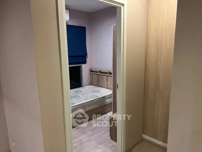 Cozy bedroom with minimalist design and natural wood accents, perfect for a serene living experience.