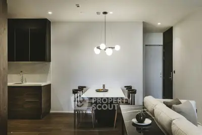 Modern open-plan living room with elegant dining area and stylish kitchen