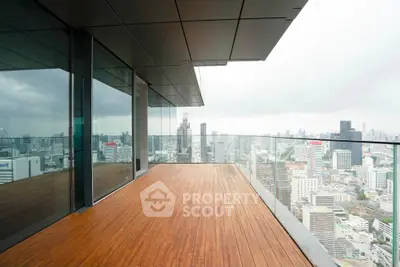 Stunning high-rise balcony with panoramic city views and sleek modern design.