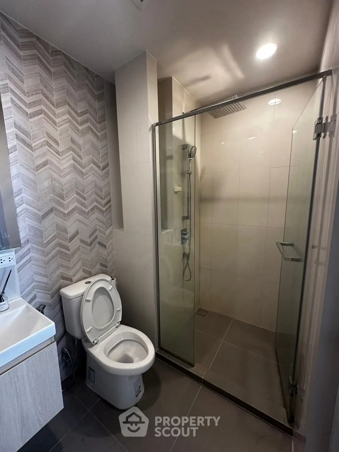 Modern bathroom with glass shower and stylish tile design