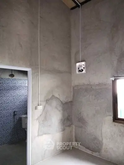 Minimalist bathroom with concrete walls and modern fixtures