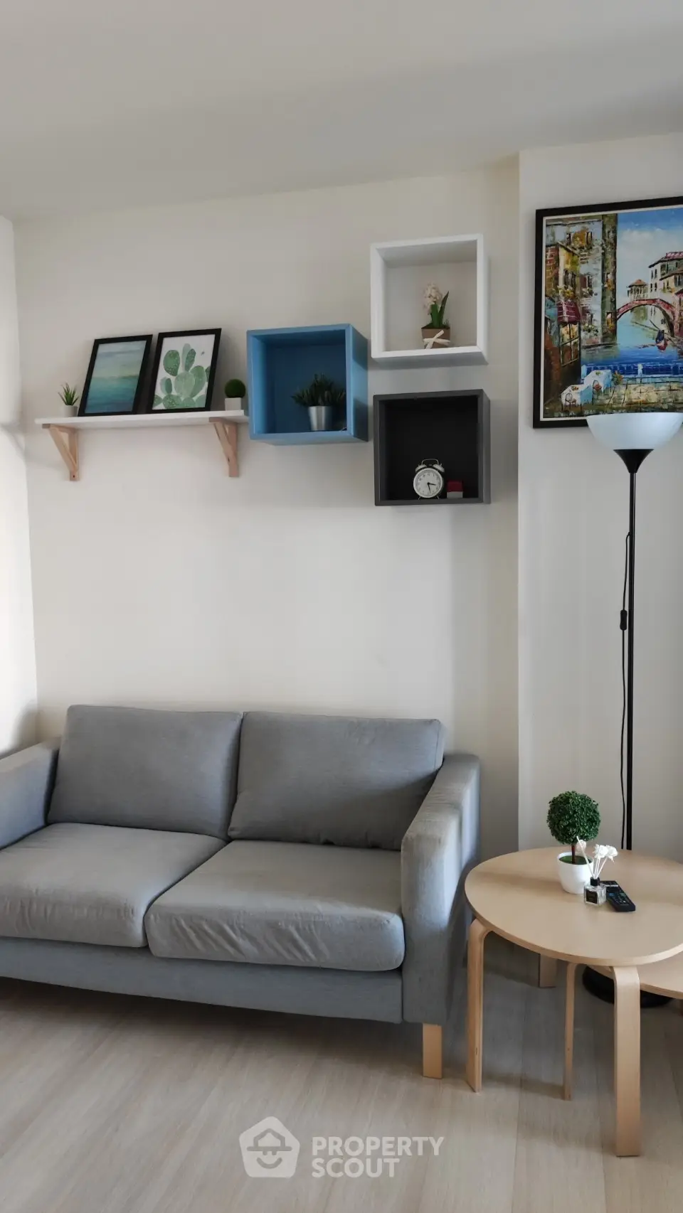 Stylish living room with modern decor and cozy gray sofa