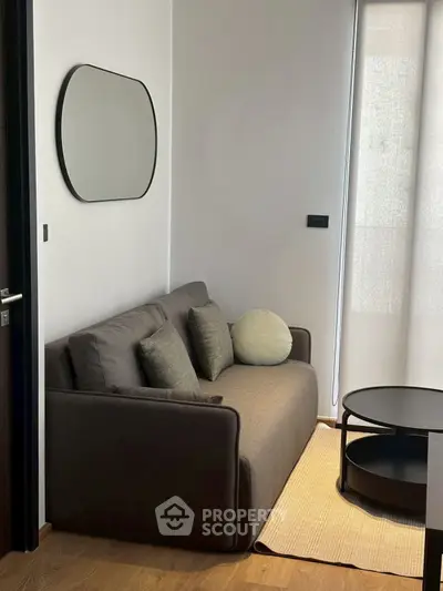 Cozy modern living room with stylish sofa and round coffee table