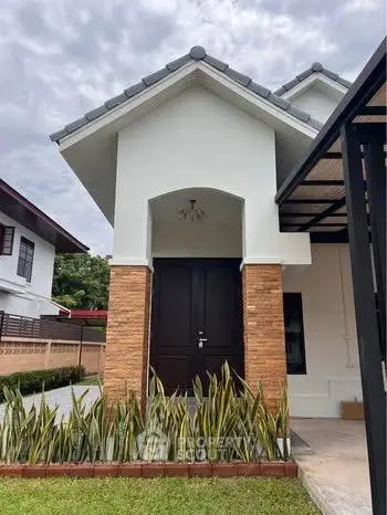 Charming modern house exterior with lush garden and stylish entrance