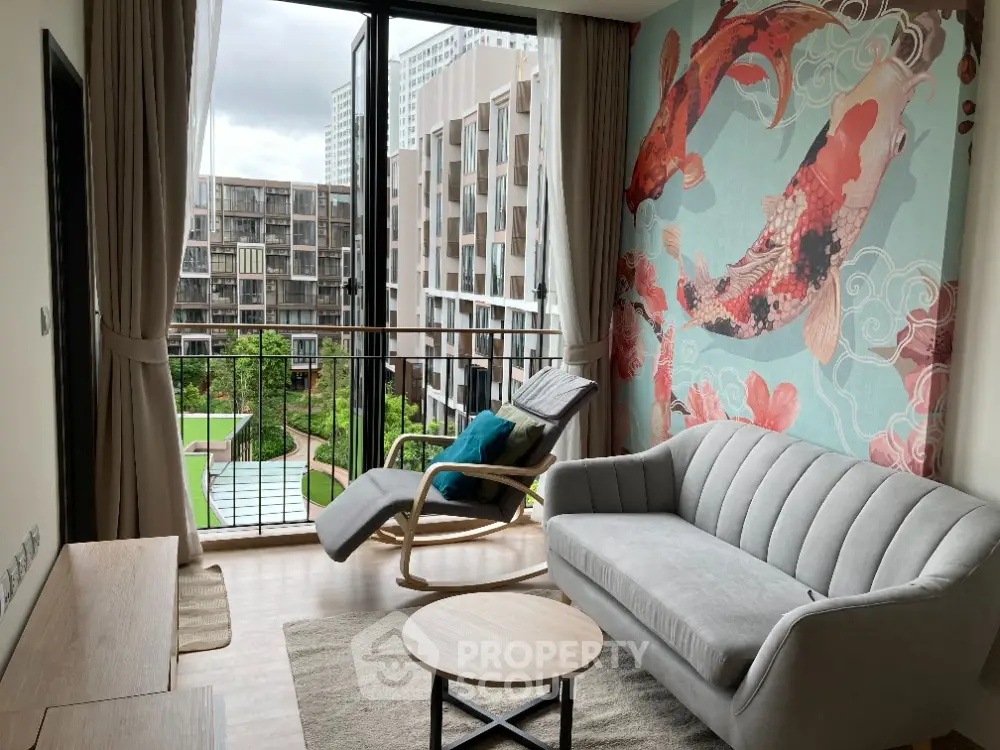 Chic modern living room with plush seating and vibrant wall art, opening onto a serene balcony with a lush garden view.
