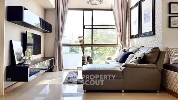 Spacious modern living room with large windows and stylish decor